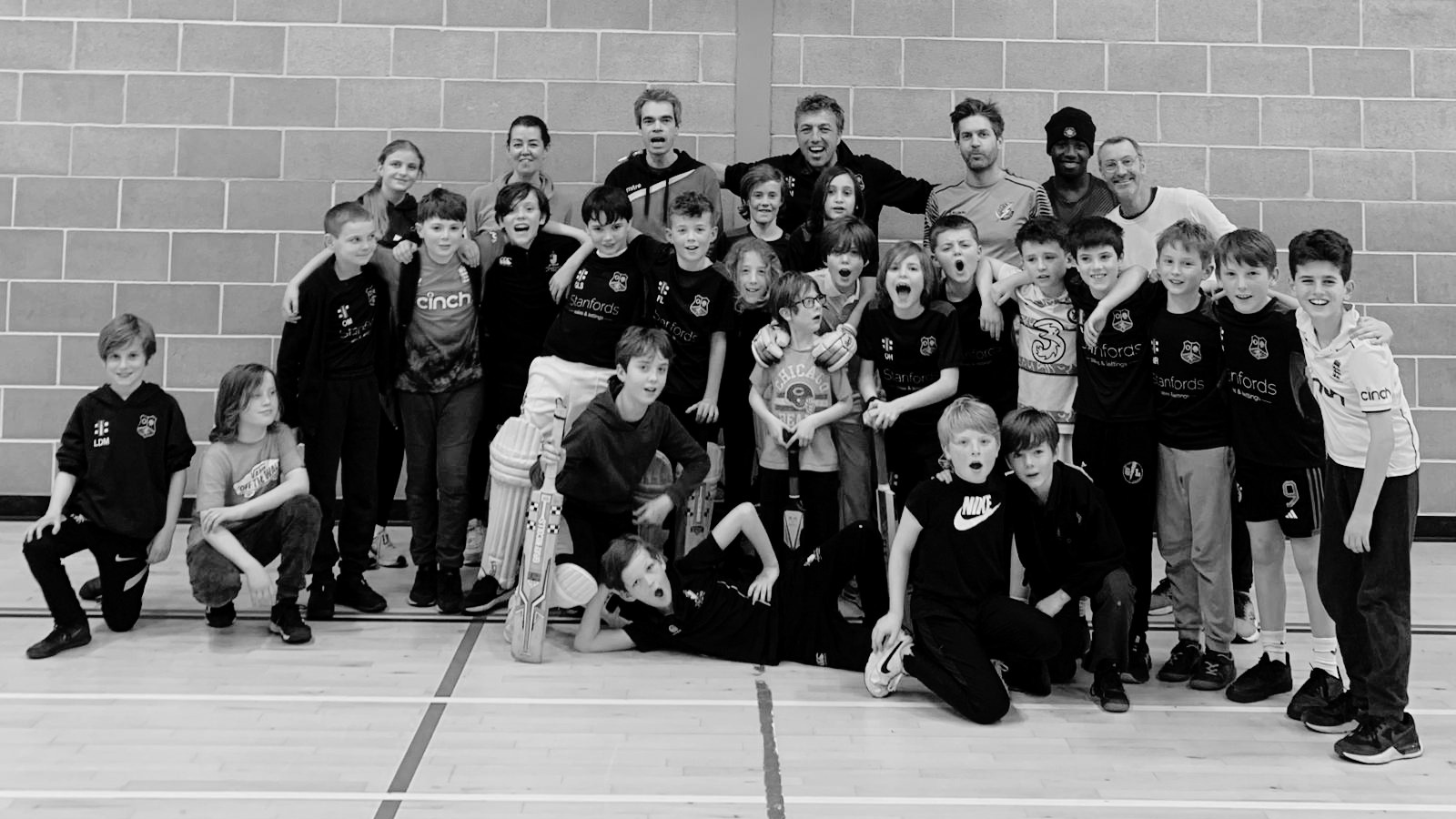 Group photo of young cricket players and coaches from the NBB coaching programme